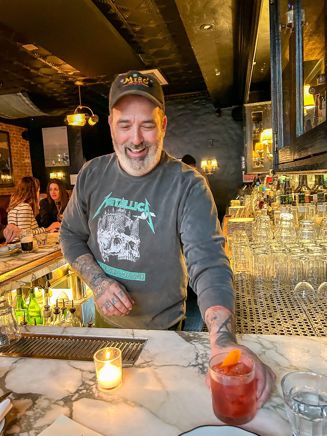 Our neighbor Ryan Gannon serves up a Negroni Primavera at Inga's Bar.